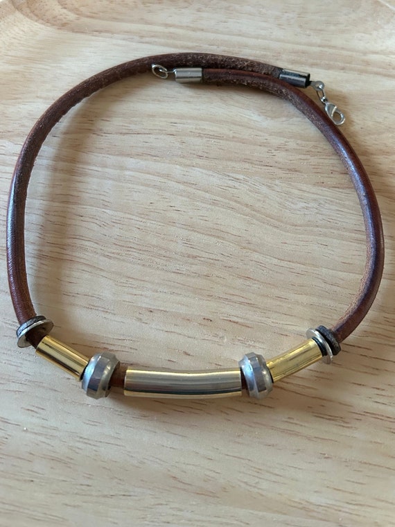 Modernist leather cord brass and silver tone colla