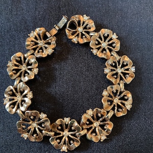 Crown Trafiri link goldtone bracelet flower motif with rhinestones