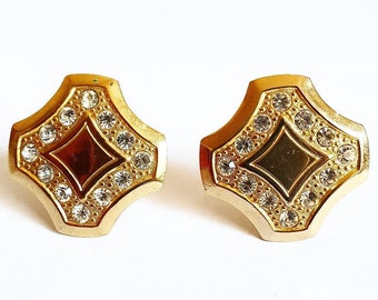 Vintage 80s clip earrings with bright rhinestones in gilded metal