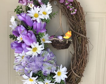Oval wreath with bird and hanging nest