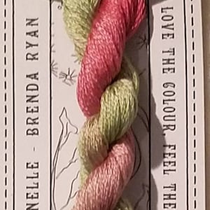 May include: A pack of three 10m pre-cut strands of hand-dyed stranded cotton embroidery floss in pink and green shades. The pack is labelled "TROIS" and "CGT Traditionelle - Brenda Ryan".