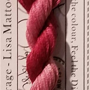 May include: A skein of Dianthus stranded cotton embroidery floss in shades of pink and red. The label reads "Forage - Lisa Mattock" and "Love the colour, Feel the Difference". The floss is pre-cut, 10 meters in length.