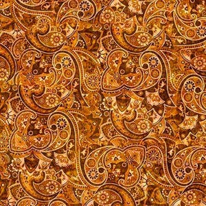 May include: A close-up of a fabric with a repeating paisley pattern. The design features intricate, swirling shapes in shades of brown, gold, and cream. The pattern is detailed and ornate, creating a rich, textured appearance.