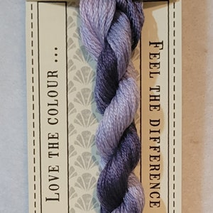 May include: Delphinium stranded cotton thread, color No. 401, pre-cut to 10 meters. The thread is a blend of purples and lavenders. The label reads "Love the Colour" and "Feel the Difference."