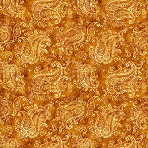 May include: A repeating pattern of golden paisley designs on a textured, brown background. The paisley shapes are detailed with floral and swirling elements, creating a rich, ornate textile design. The overall effect is a warm, vintage aesthetic.