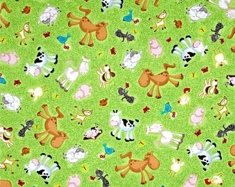 24948-G Quilting Treasures Animal Farm Tossed on Green. Priced by the half yard.