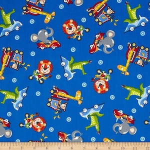 3028-77 Studio E Safari Drive Blue. Priced by the half yard.