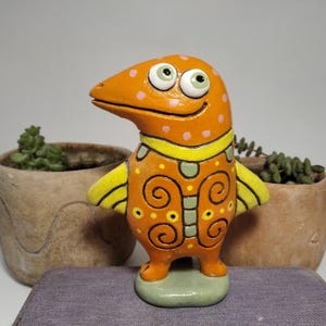 Hand-Painted Clay Monster Bird Figurine: Whimsical Home Decor