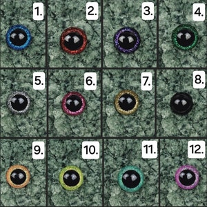 May include: Twelve different colours of plastic googly eyes with glitter. The eyes are arranged in a grid of four rows and three columns. Each eye has a black pupil and a silver ring around the pupil.