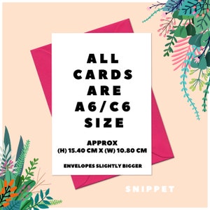 May include: A white card with black text that reads "ALL CARDS ARE A6/C6 SIZE APPROX (H) 15.40 CM X (W) 10.80 CM ENVELOPES SLIGHTLY BIGGER" and the word "SNIPPET" in black text at the bottom. The card is sitting on a pink envelope.