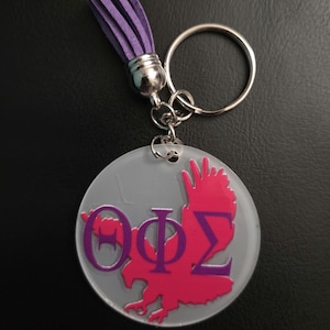 Theta Phi Sigma Greek Symbol Vinyl Keychain with Purple Tassel