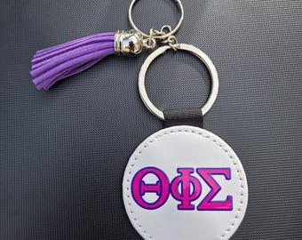 Theta Phi Omega Griechisches Symbol Leder Schlüsselanhänger mit Lila Quaste