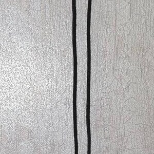 May include: A black gemstone pendant necklace with a silver wire cage. The necklace has a black cord and a silver clasp.