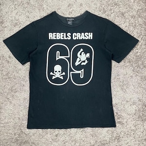May include: Black t-shirt with the text "REBELS CRASH" above a large white number "69". The number "69" has a skull and crossbones on the left and a graphic on the right. The shirt is short-sleeved.