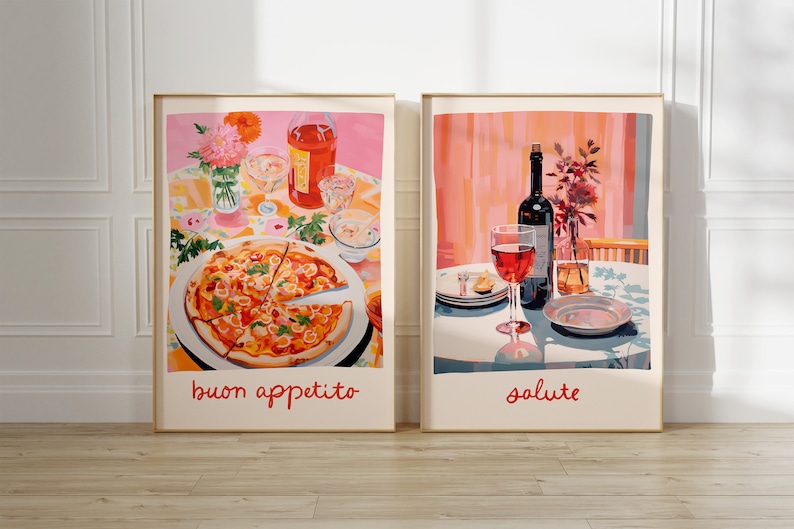 May include: Two framed prints with a pink background. The left print shows a pizza with the text "buon appetito". The right print shows a glass of red wine and a bottle of wine with the text "salute".