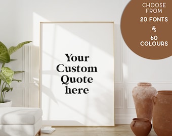 May include: A white framed poster with the text "Your Custom Quote here" in black bold font. The poster is leaning against a white wall with a brown circle in the upper right corner that says "Choose from 20 Fonts & 60 Colours".