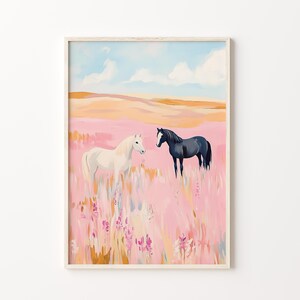 May include: A white horse and a black horse stand in a field of pink wildflowers. The sky is blue with white clouds.