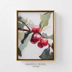 Puede incluir: Una pintura enmarcada de bayas rojas en una rama con hojas verdes, representada en un estilo pictórico con pinceladas visibles. La obra está en un marco dorado fino. Debajo del marco, el texto dice GRACEFUL GINGER design.