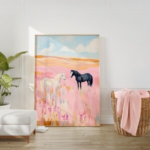 May include: A painting of two horses in a field of pink flowers. The horse on the left is white and the horse on the right is black. The sky is blue with white clouds.