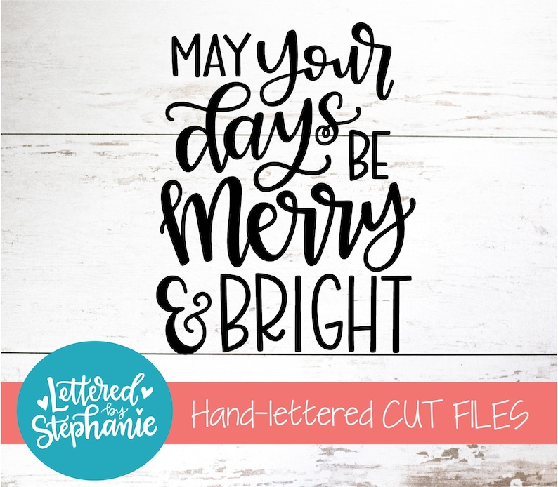 May include: Black and white hand-lettered design on a white wood background. The design says "May your days be merry & bright".
