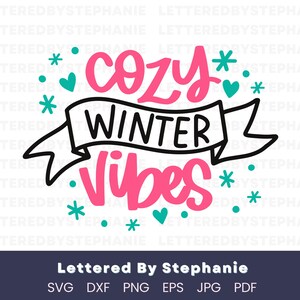 May include: A graphic design with the words "cozy winter vibes" in pink and black, surrounded by teal hearts and snowflakes. The design includes the text "Lettered By Stephanie" and file type options.