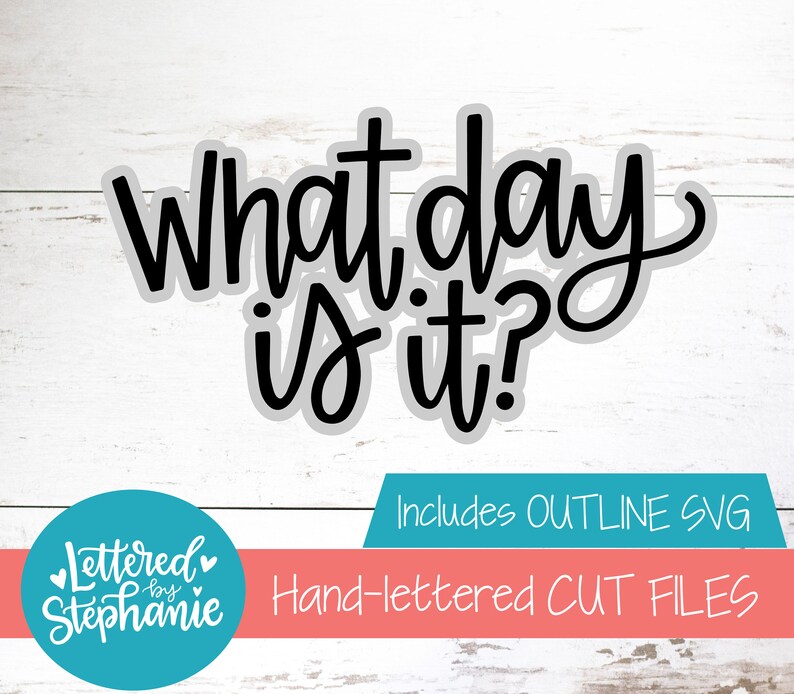 May include: Black and white hand-lettered text on a wood background that reads "What day is it?"  Includes Outline SVG. Lettered by Stephanie. Hand-lettered cut files.