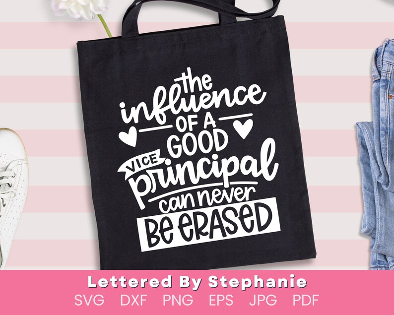 May include: A black tote bag with white text that reads "The influence of a good principal can never be erased".