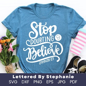 May include: A blue t-shirt with white text that reads "Stop Doubting & Believe John 20:27".
