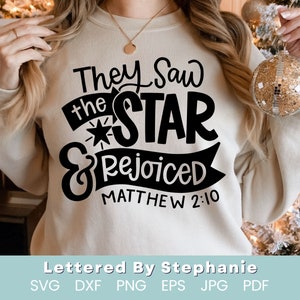 May include: A beige sweatshirt with black text that reads "They Saw the STAR & Rejoiced Matthew 2:10".