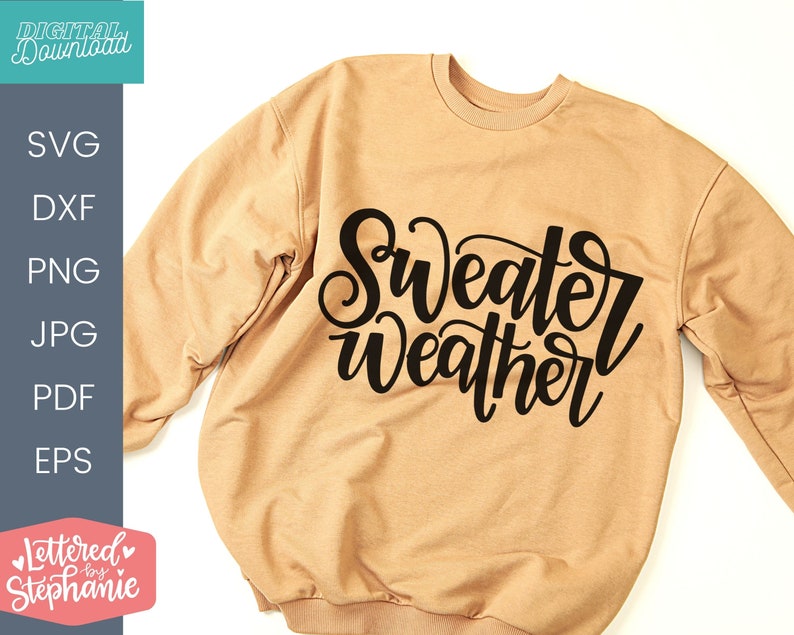 May include: A tan sweatshirt with the text "Sweater Weather" in black cursive lettering.