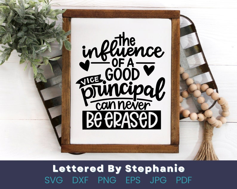 May include: A white sign with a brown wooden frame, featuring a black and white graphic that reads "The influence of a good principal can never be erased".