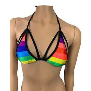 May include: A rainbow striped bikini top with black straps and a criss-cross design.