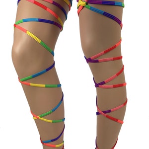 May include: Rainbow colored leg garters with heart-shaped rings. The garters are made of a stretchy material and are tied around the legs.