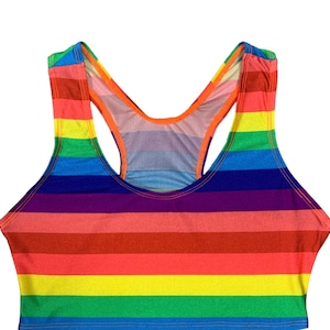 May include: A rainbow striped racerback tank top with a scoop neck.