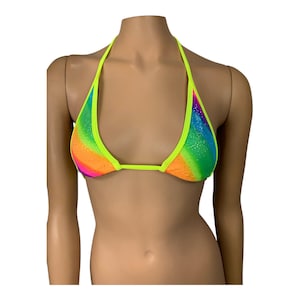 May include: A neon green and rainbow bikini top with a halter style strap. The top is covered in small iridescent sequins.