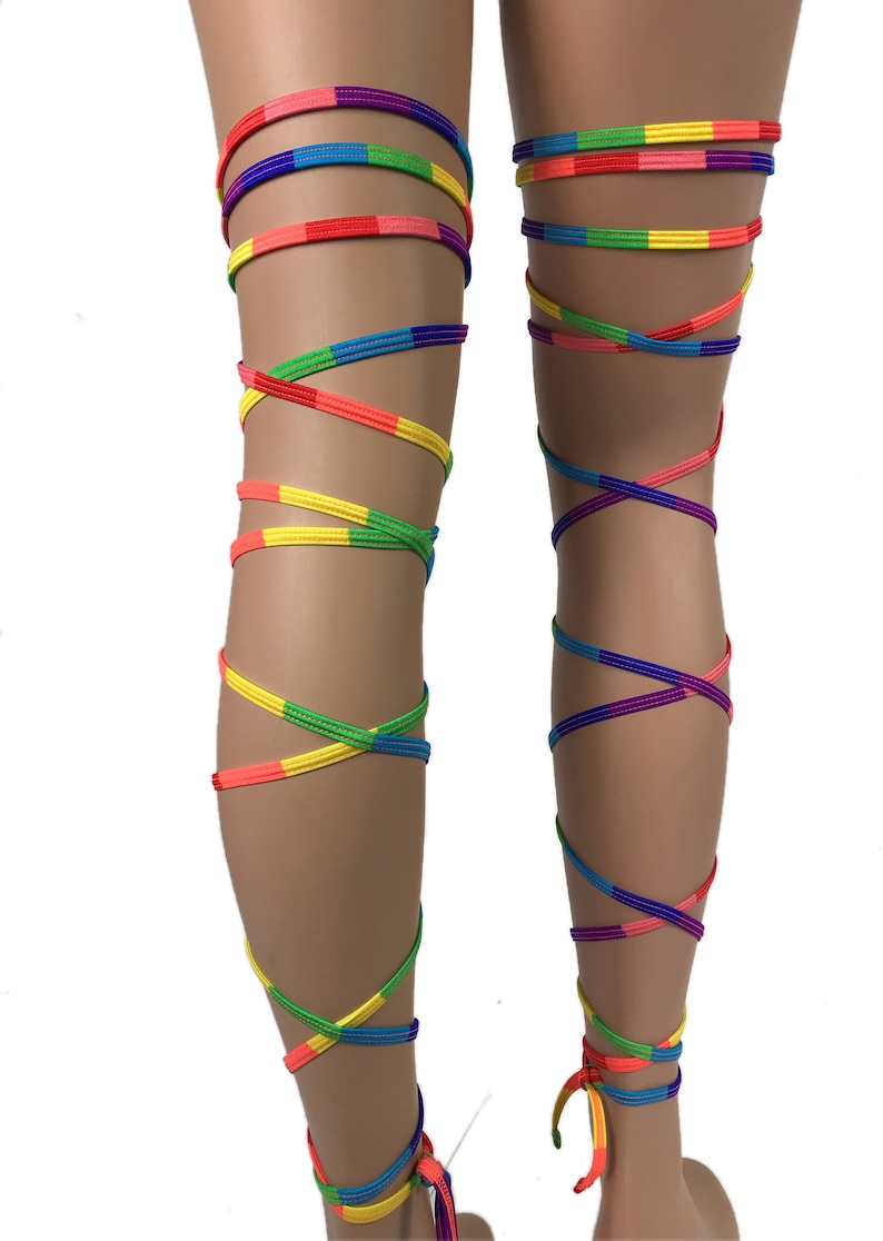 May include: Rainbow colored leg wraps, tied around the legs in a criss-cross pattern. The wraps are made of a soft, stretchy material and are perfect for adding a pop of color to any outfit.