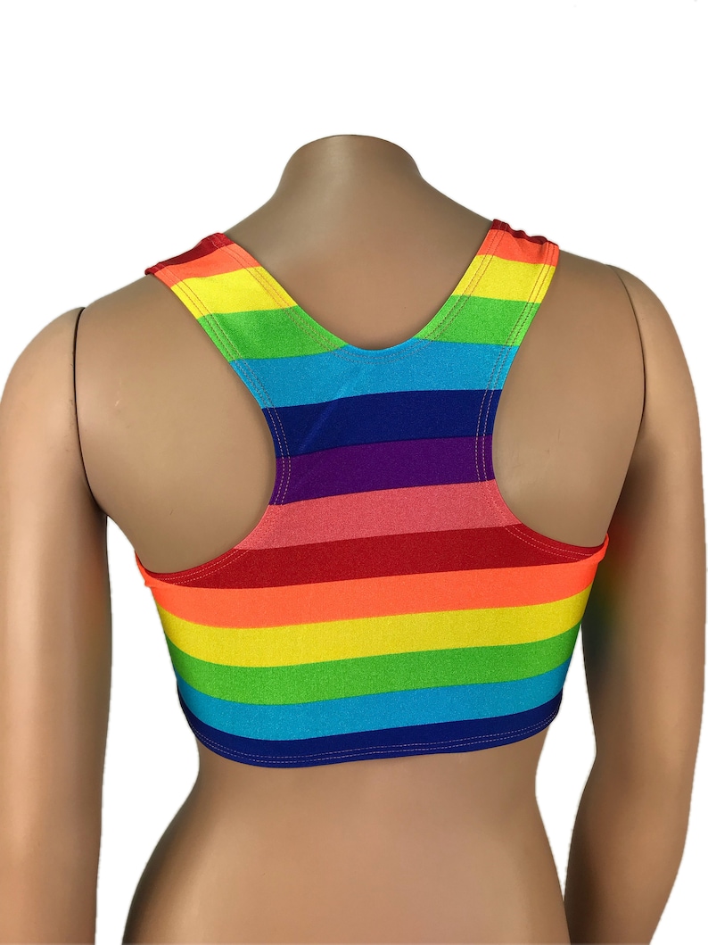 May include: A rainbow striped tank top with a racerback style. The tank top is cropped and has a bright, colorful design.