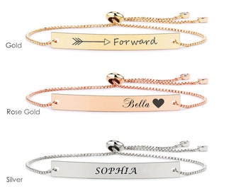 May include: Three adjustable bracelets with a thin chain and a rectangular bar charm. The charms are engraved with the words "Forward", "Bella" with a heart symbol, and "SOPHIA". The bracelets are available in gold, rose gold, and silver.