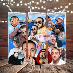 May include: A colourful stainless steel tumbler featuring a collage of images of a rapper. The tumbler has a blue background and includes the text "Mac Miller".