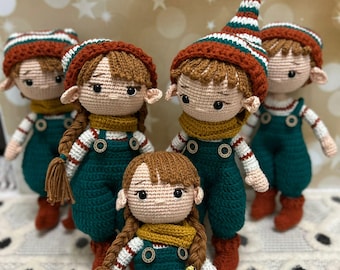 May include: Five crocheted elf dolls with brown hair, green and white striped hats, and green overalls. The dolls are wearing brown boots and have brown yarn braids.