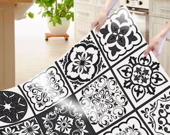 May include: Black and white patterned floor tiles with a geometric design. The tiles are peel and stick and can be used to decorate floors, walls, or furniture.