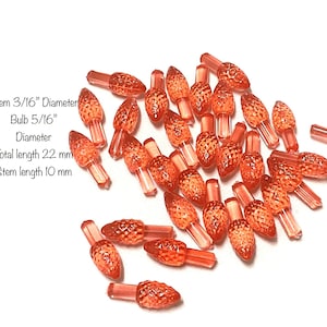 May include: A pile of 22 mm long, red, plastic Christmas tree light bulbs with a 5/16 inch diameter bulb and a 3/16 inch diameter stem. Stem length is 10 mm.