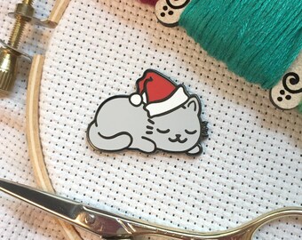 Sleepy Christmas Kitty Magnetic Enamel Needle Minder | Grey Santa Hat Cat Cross Stitch Needleminder | Cute Holiday Kitten Sleeping Magnet
