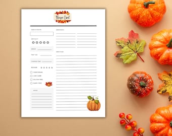 Pode incluir: Cartão de receita imprimível com tema de outono. O cartão tem um título, ingredientes, instruções e uma seção de revisão. Também tem um espaço para notas. O cartão é decorado com folhas de outono e abóboras.