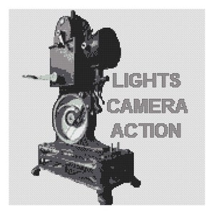 May include: A black and white image of a vintage movie camera with the text "LIGHTS CAMERA ACTION" printed below it.