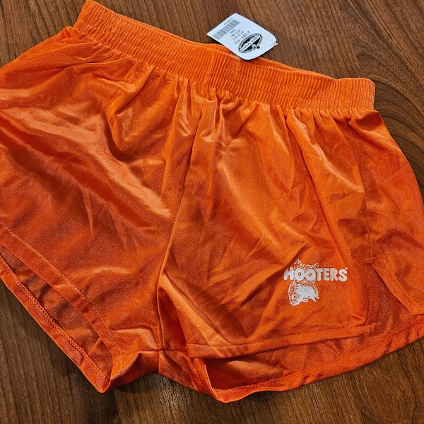 Vintage new Hooters original dolphin style shorts small orange