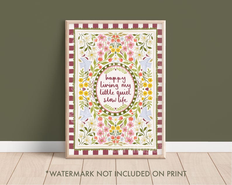 May include: A framed rectangular print featuring a border of maroon and white stripes. The central design displays colorful flowers, green leaves, and four light blue birds surrounding an oval frame with the text, happy living my little quiet slow life.