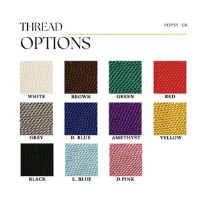 May include: A chart showing thread color options for embroidery. The colors are white, brown, green, red, grey, dark blue, amethyst, yellow, black, light blue, and dark pink.
