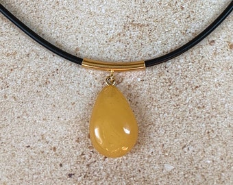 Amber pendant made of natural Baltic amber on a rubber cord, honey amber, amber and gold choker