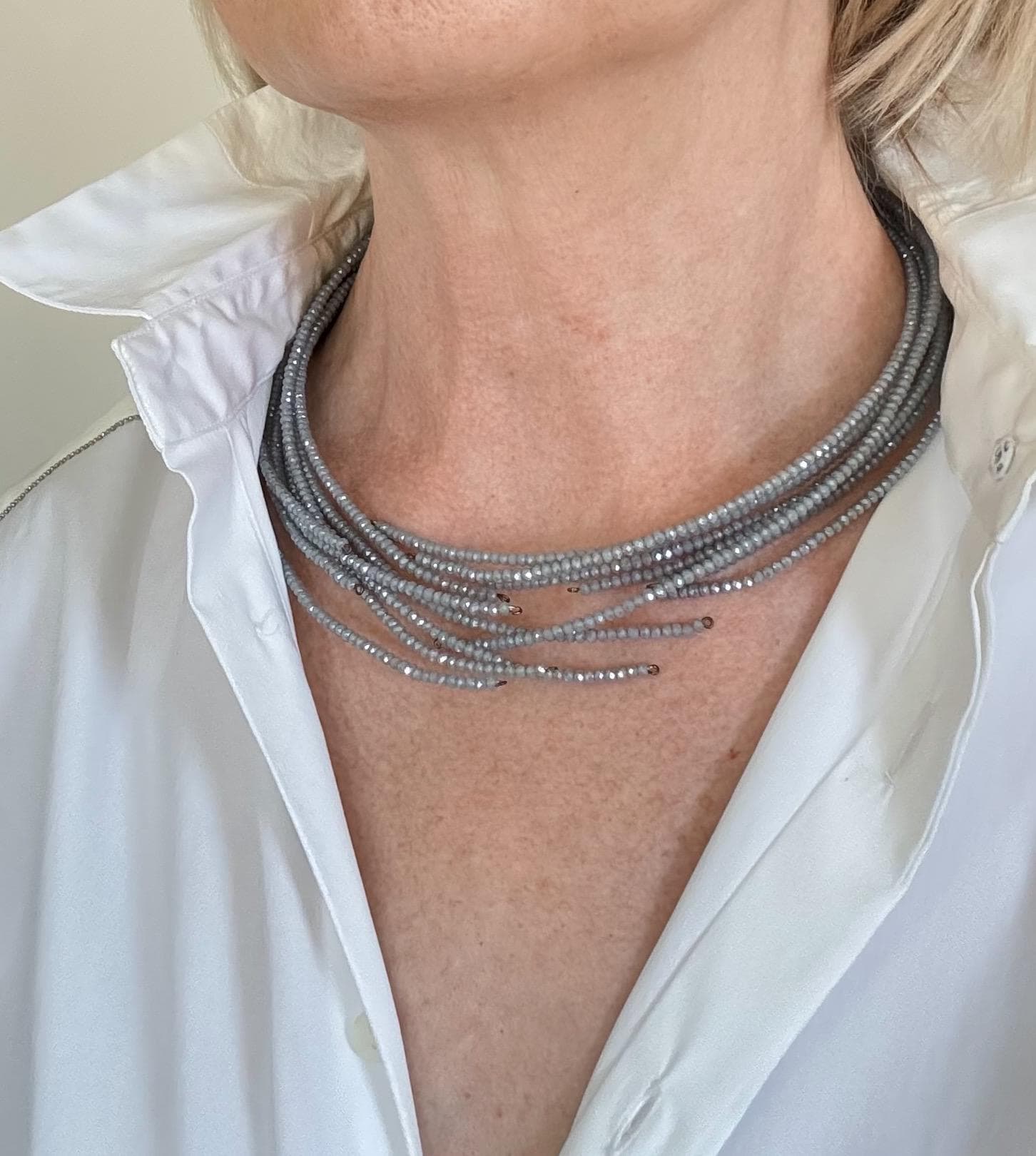 Multi strand choker necklace made of gray tone crystals and genuine leather